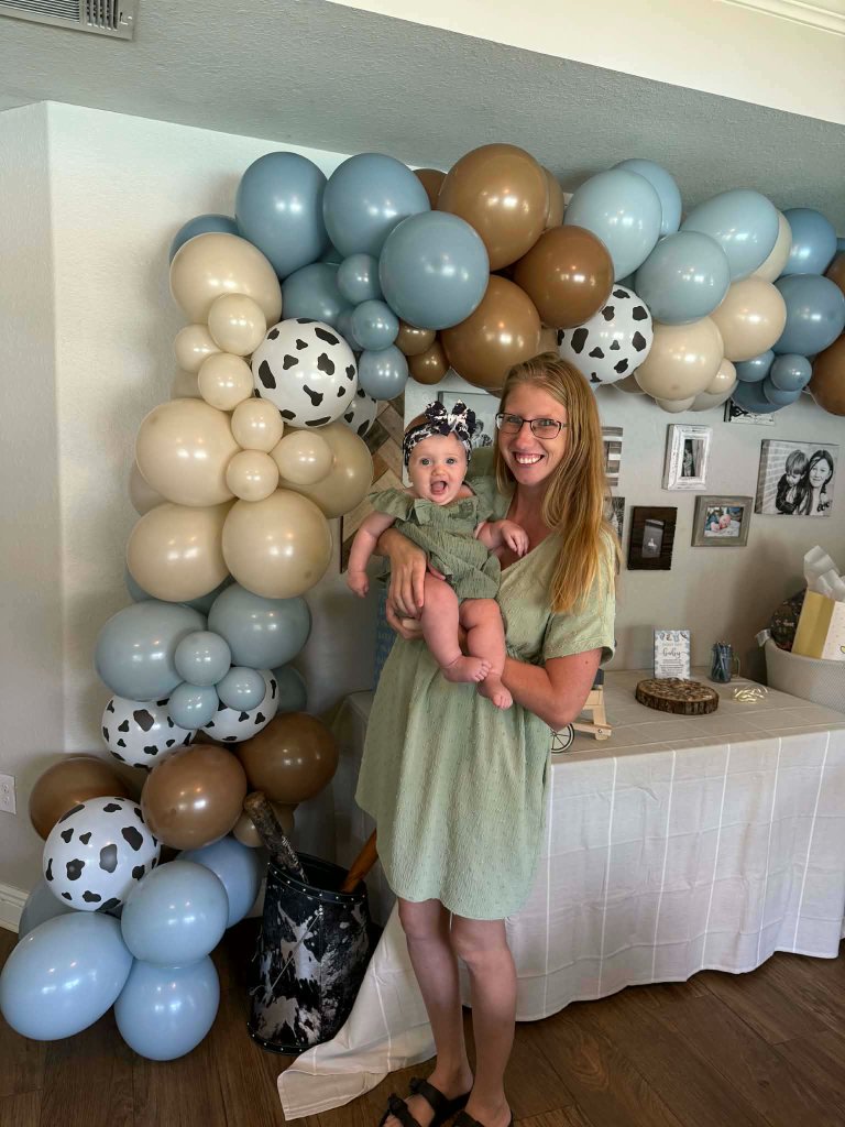 Dusty blue, sand and mocha garland with cow-print balloons